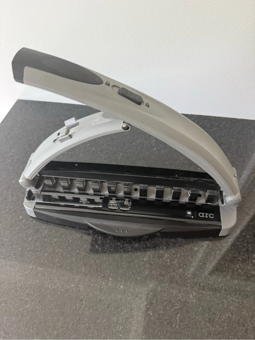 Staples Arc desktop paper punch in Gray and Black